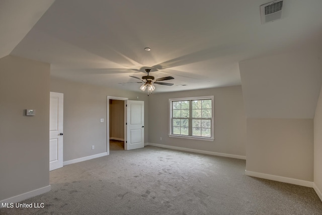 interior space featuring light colored carpet and ceiling fan