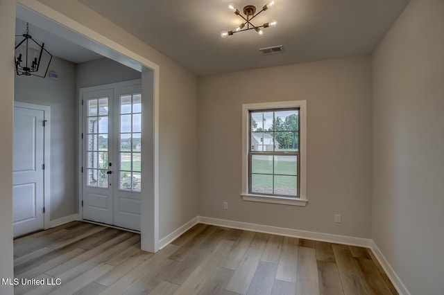 9070 Bennett Trl, Hernando, MS 38632 - entryway with a chandelier, healthy amount of natural light, and wood finished floors