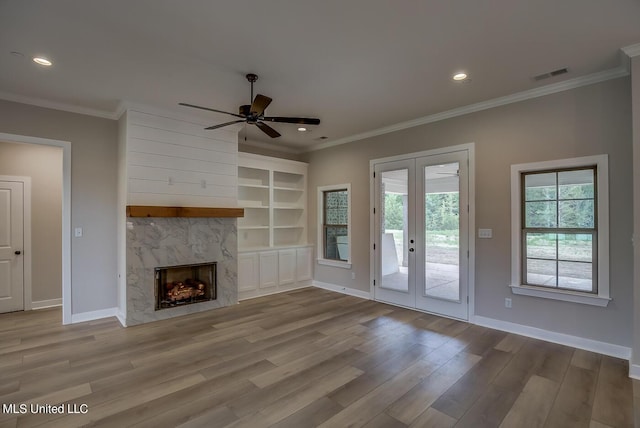 9070 Bennett Trl, Hernando, MS 38632 - unfurnished living room with french doors, wood finished floors, baseboards, a ceiling fan, and ornamental molding