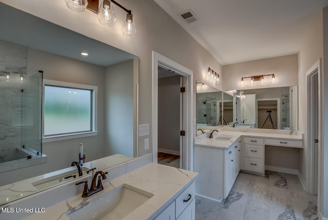 bathroom with vanity and an enclosed shower