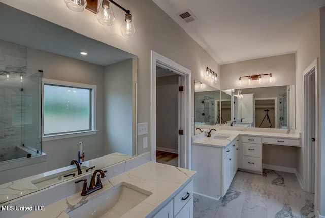 9070 Bennett Trl, Hernando, MS 38632 - bathroom featuring a stall shower, two vanities, marble look tiles, and baseboards