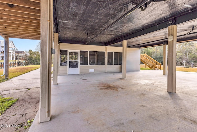 view of patio with a sunroom