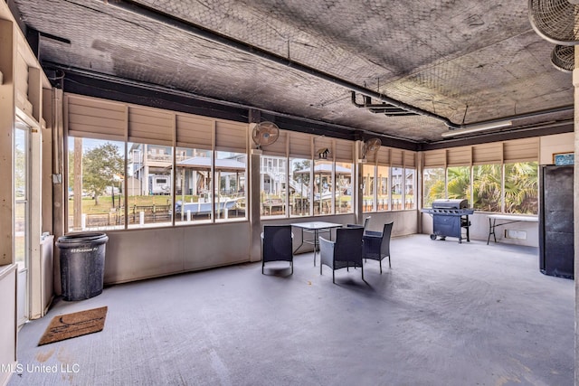 unfurnished sunroom featuring a wealth of natural light