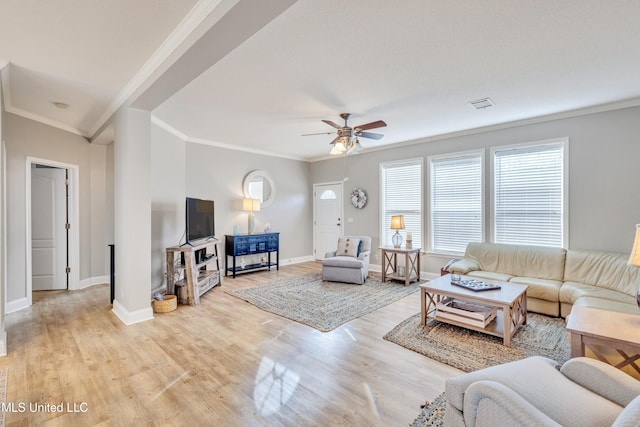 living room with crown molding, ceiling fan, and light hardwood / wood-style floors