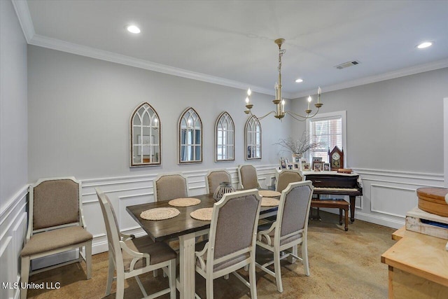 148 Stanton Hall Dr, Florence, MS 39073 - dining area with a decorative wall, crown molding, a wainscoted wall, and a chandelier