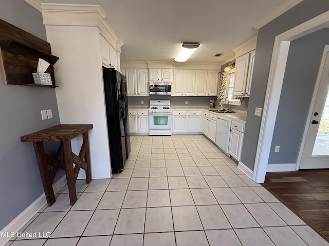 kitchen featuring white appliances, a sink, white cabinetry, light countertops, and ornamental molding