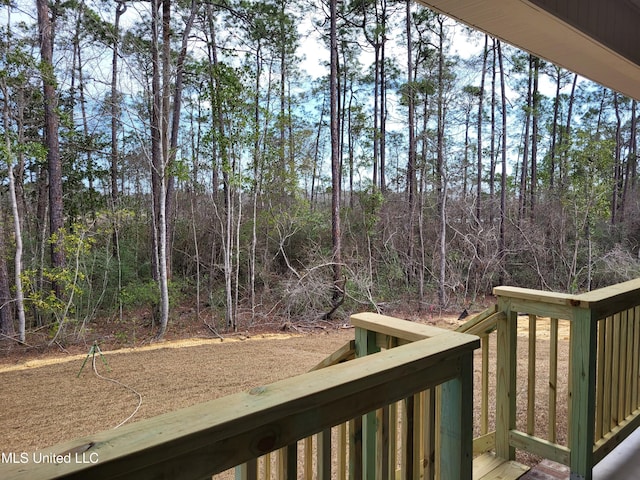 view of yard with a view of trees