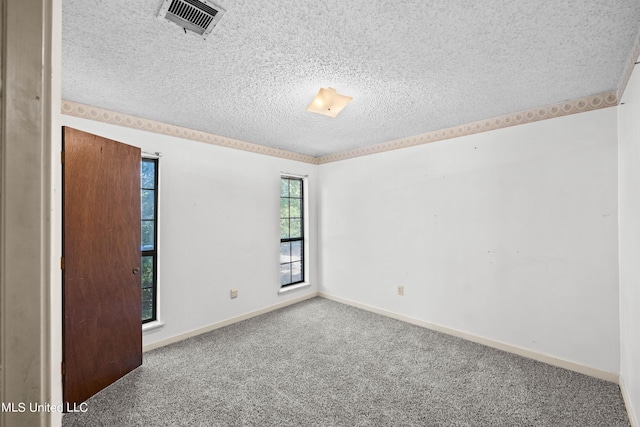 465 Heritage Pl, Jackson, MS 39212 - spare room featuring a textured ceiling, carpet, and baseboards