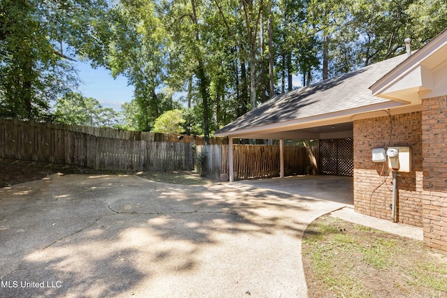 465 Heritage Pl, Jackson, MS 39212 - view of yard with fence, concrete driveway, and a carport