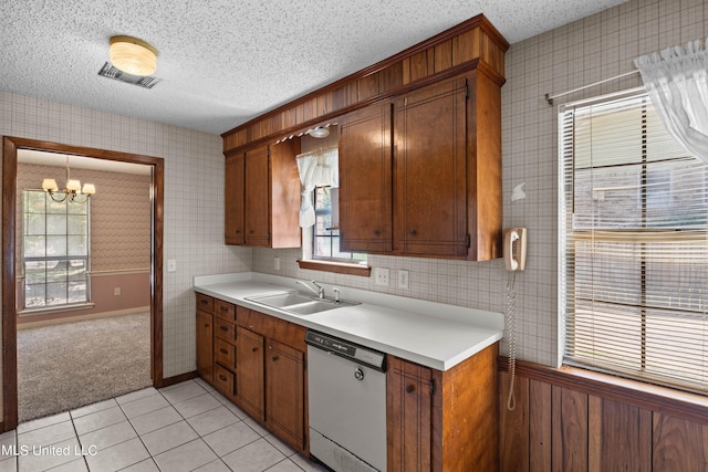 465 Heritage Pl, Jackson, MS 39212 - kitchen with dishwashing machine, a sink, wallpapered walls, a chandelier, and light countertops