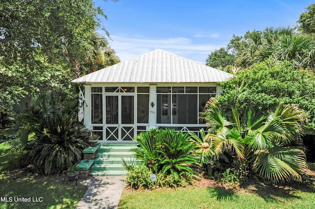 view of front facade with a sunroom