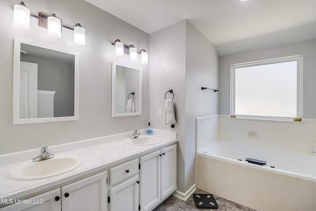 full bath with double vanity, a garden tub, and a sink