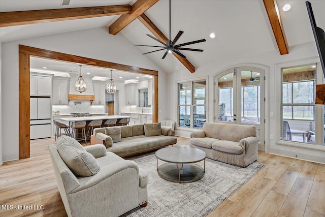 living area featuring high vaulted ceiling, french doors, beam ceiling, and light wood-style floors