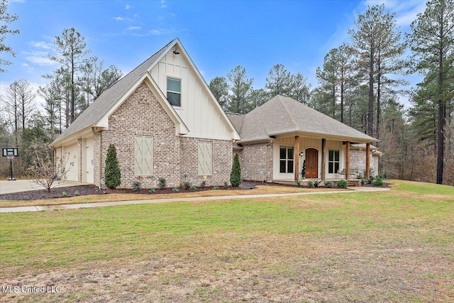 view of front facade featuring brick siding, a shingled roof, board and batten siding, a garage, and a front lawn