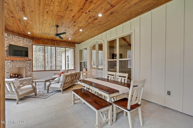 sunroom / solarium with ceiling fan, french doors, and wood ceiling