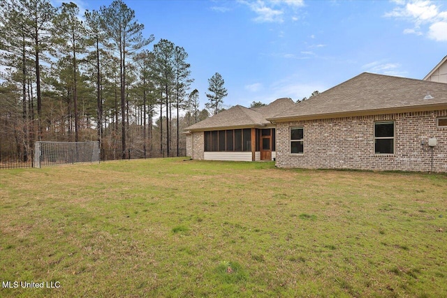 view of yard with a sunroom