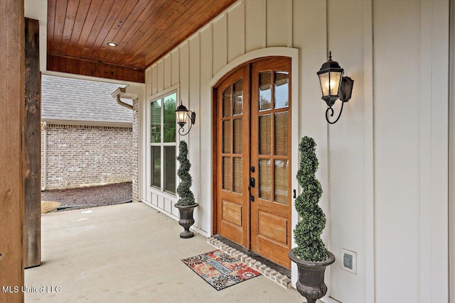 view of exterior entry featuring french doors