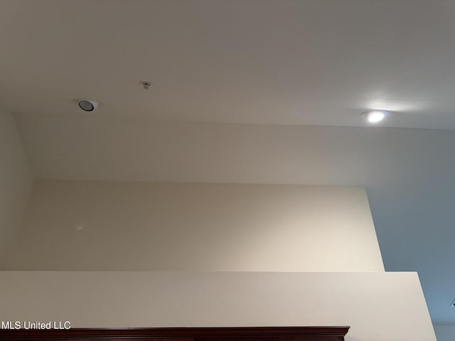 detailed view of fire sprinkler in ceiling and recessed lighting