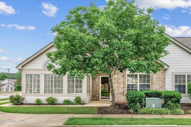 8761 Parkview Oaks Cir, Olive Branch, MS 38654 - obstructed view of property with brick siding