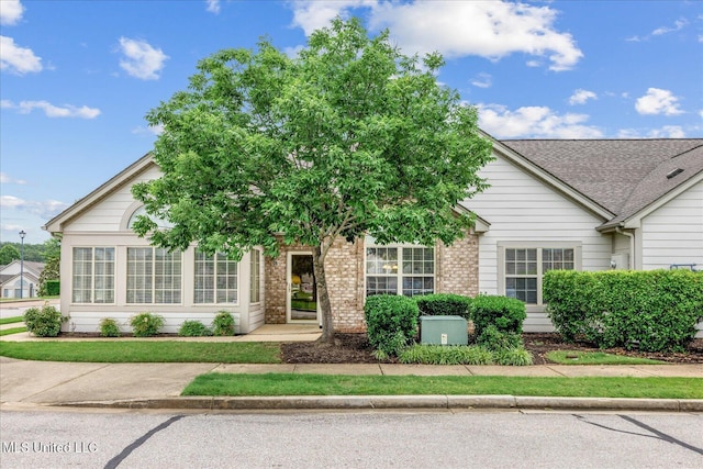 8761 Parkview Oaks Cir, Olive Branch, MS 38654 - view of property hidden behind natural elements featuring brick siding