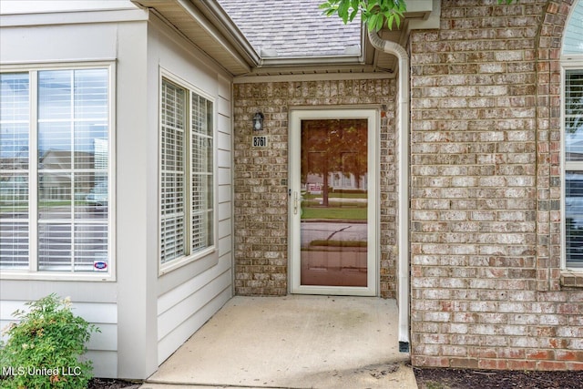 8761 Parkview Oaks Cir, Olive Branch, MS 38654 - property entrance featuring brick siding and roof with shingles