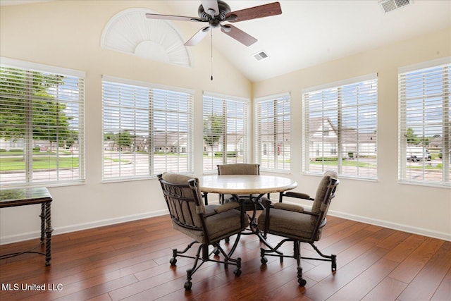 8761 Parkview Oaks Cir, Olive Branch, MS 38654 - dining room with vaulted ceiling, plenty of natural light, baseboards, and dark wood finished floors