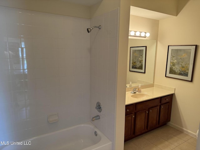bathroom featuring tile patterned floors, shower / washtub combination, vanity, and baseboards