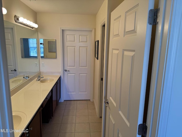 full bathroom with tile patterned floors and double vanity