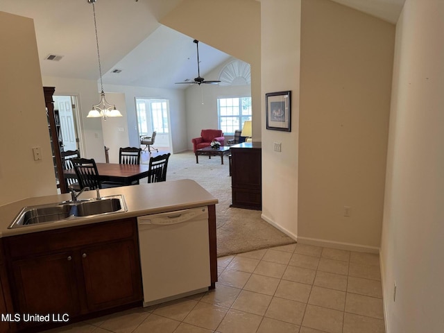 kitchen with dishwasher, light colored carpet, a sink, vaulted ceiling, and baseboards