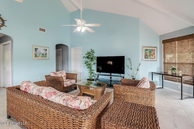 living room with beamed ceiling, high vaulted ceiling, ceiling fan, and light tile patterned flooring