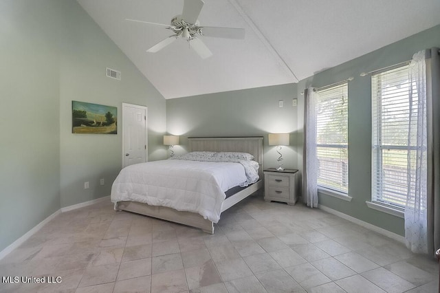 bedroom with light tile patterned floors, high vaulted ceiling, and ceiling fan