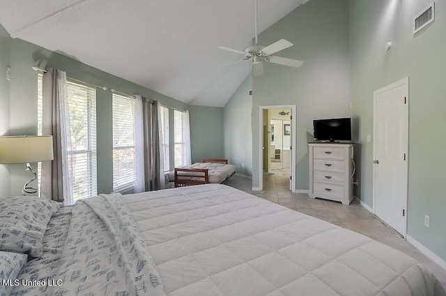 bedroom with light tile patterned floors, ensuite bathroom, high vaulted ceiling, and ceiling fan