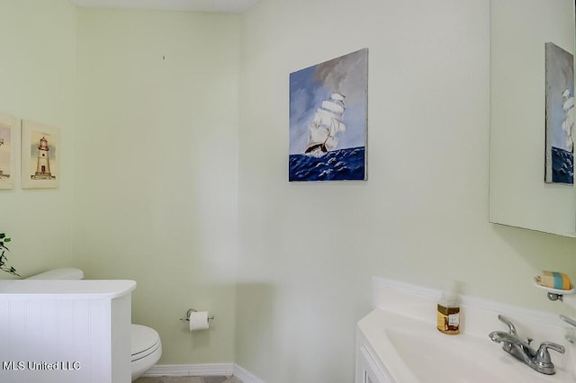 bathroom featuring toilet and sink