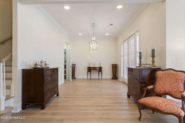 sitting room with recessed lighting, stairway, ornamental molding, light wood-type flooring, and baseboards