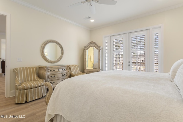 bedroom with crown molding, visible vents, ceiling fan, wood finished floors, and access to outside