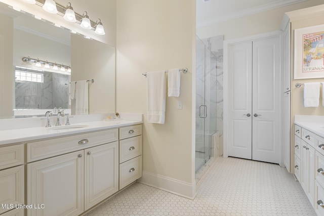 full bath with baseboards, a marble finish shower, vanity, and crown molding