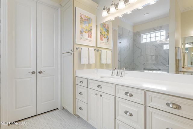 bathroom with a marble finish shower, crown molding, and vanity