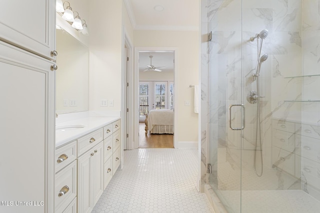 ensuite bathroom featuring vanity, baseboards, a marble finish shower, ensuite bath, and crown molding