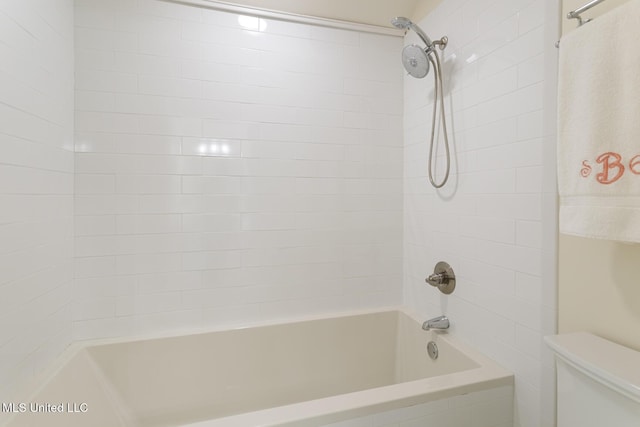 full bath with washtub / shower combination and toilet