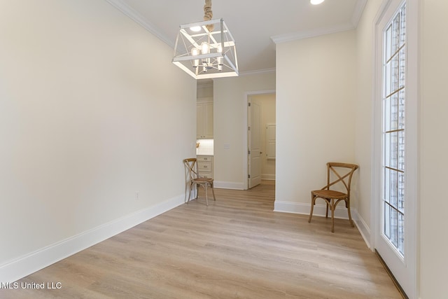 unfurnished dining area featuring baseboards, ornamental molding, a notable chandelier, and light wood-style floors