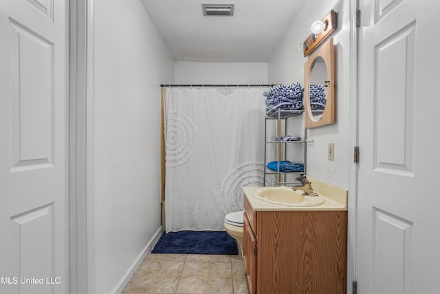 bathroom with tile patterned floors, a textured ceiling, toilet, vanity, and a shower with shower curtain