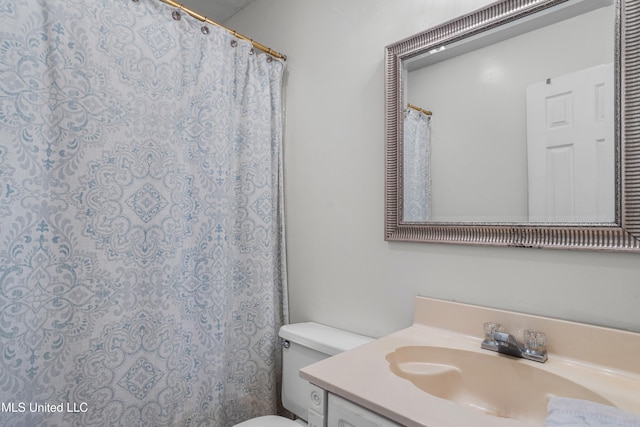 bathroom featuring vanity and toilet