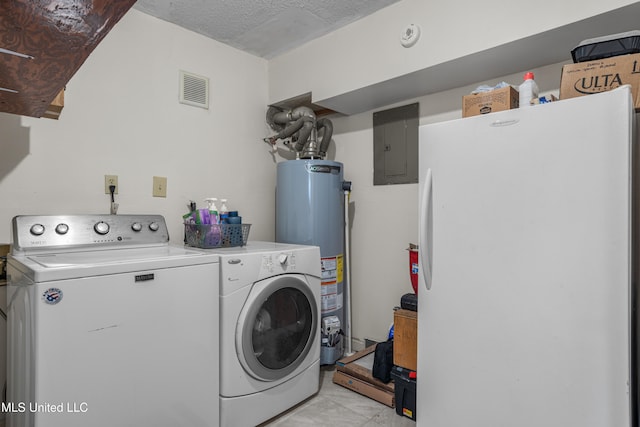 laundry room featuring separate washer and dryer, a textured ceiling, electric panel, and water heater