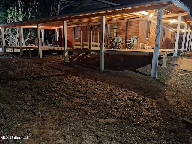 back of house with brick siding