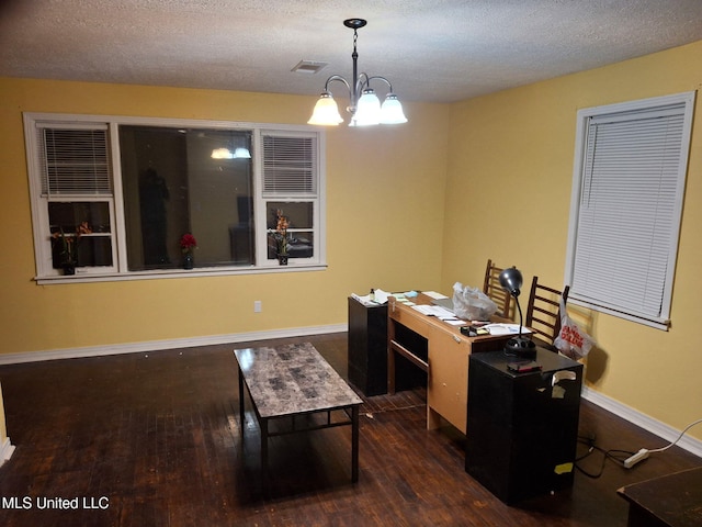 office with wood finished floors, baseboards, visible vents, a textured ceiling, and a chandelier