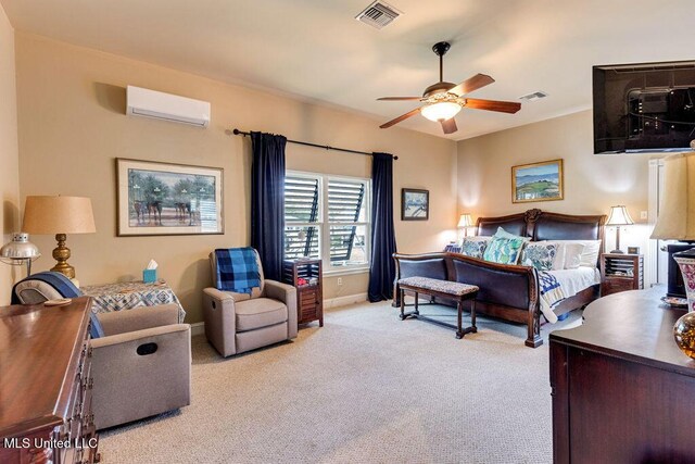 carpeted bedroom featuring a wall unit AC and ceiling fan