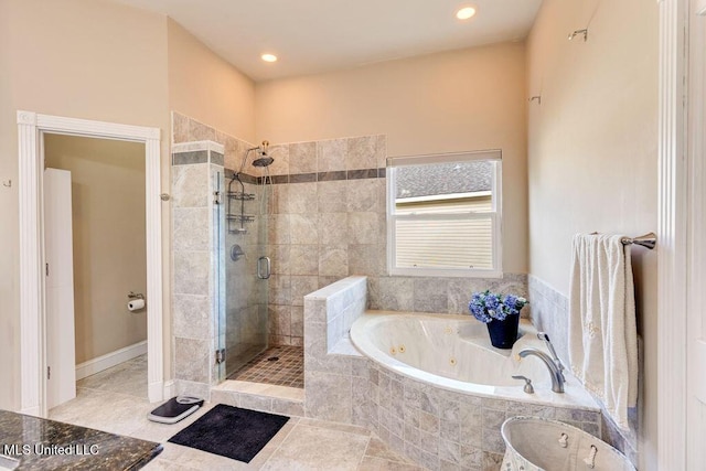 bathroom featuring tile patterned floors and shower with separate bathtub