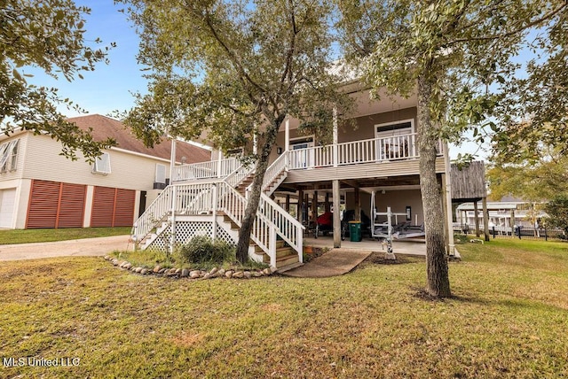 back of house featuring a patio and a yard