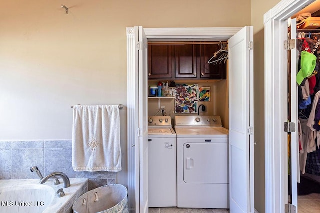 washroom with independent washer and dryer