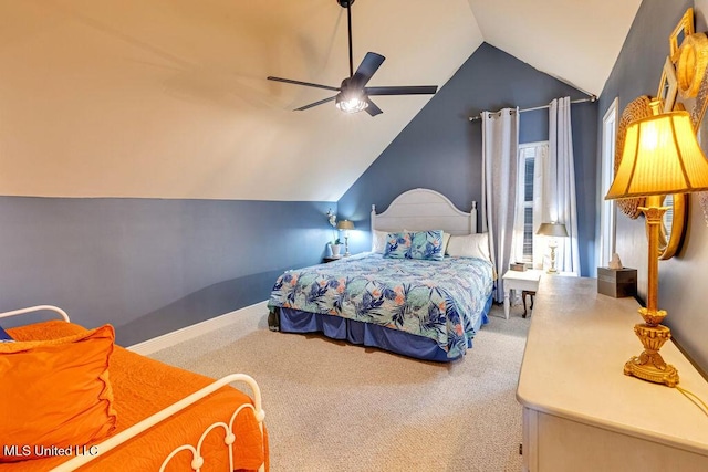 bedroom featuring ceiling fan, vaulted ceiling, and carpet flooring